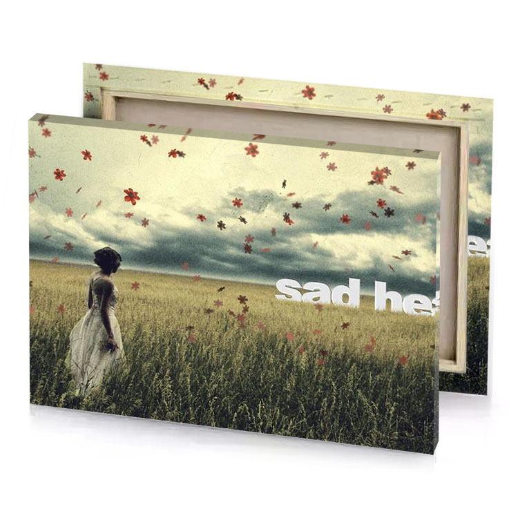 a woman standing in field with leaves flying around her dark khaki canvas