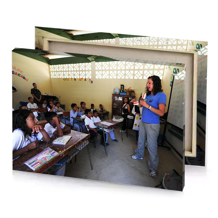 a woman standing in front of classroom tan canvas