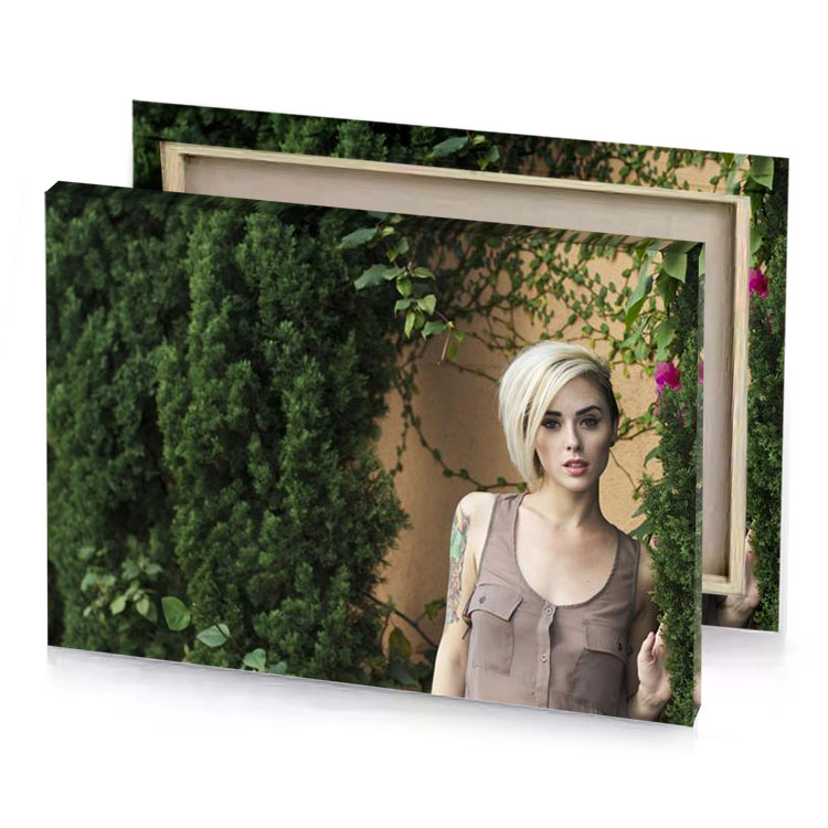 a woman standing in front of wall with flowers bistre canvas