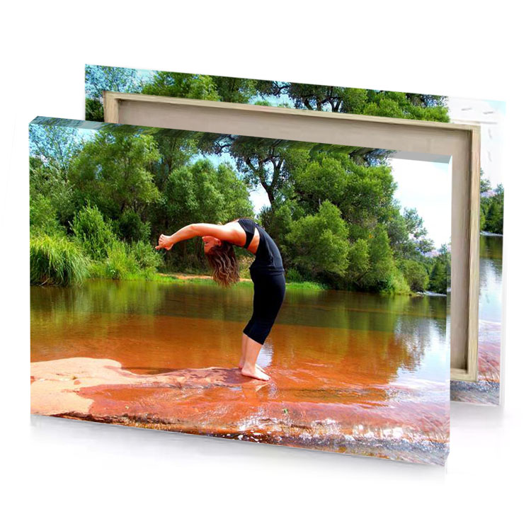 a woman standing on rock in river dark olive green canvas