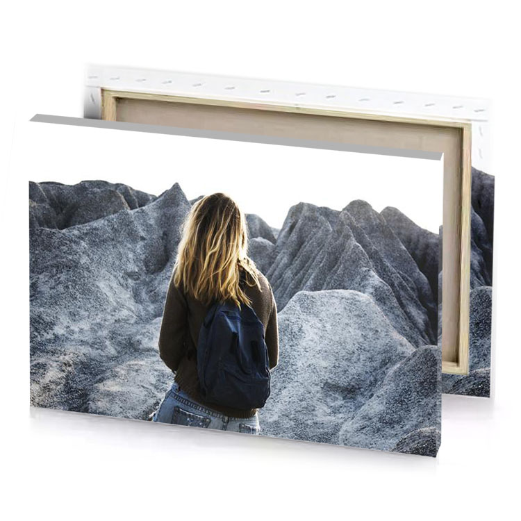 a woman standing on rocky mountain zinnwaldite brown canvas