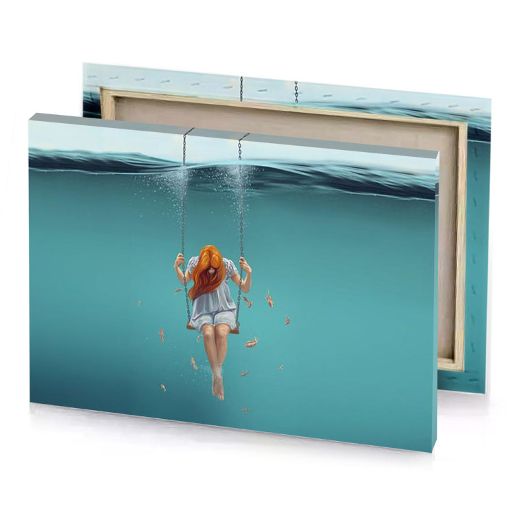 a woman swinging on rope in the ocean cadet blue canvas