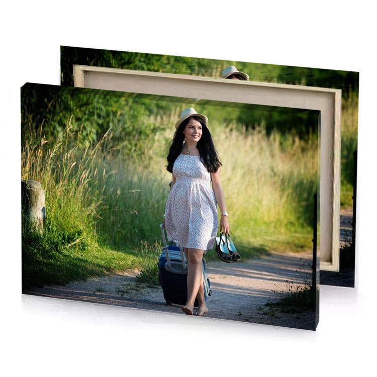a woman walking down dirt road carrying suitcase hunter green canvas