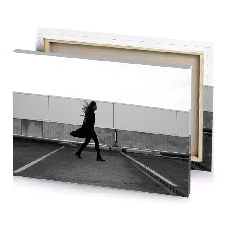 a woman walking down street with skateboard black canvas