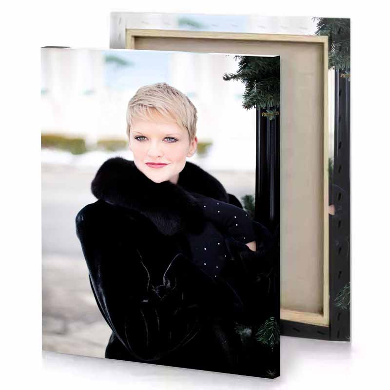 a woman wearing black coat and fur smoky canvas