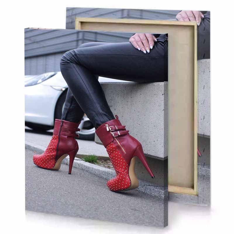 a woman wearing red high heels and black pants charcoal canvas