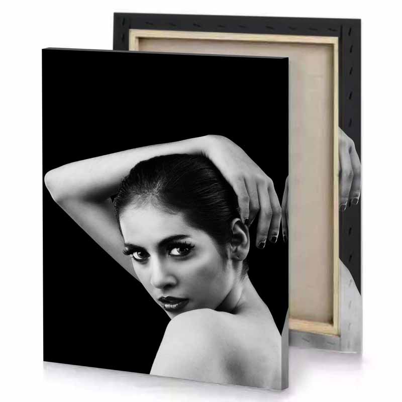 a woman with black background and canvas