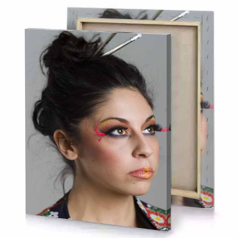 a woman with colorful make up and pair of scissors manatee canvas