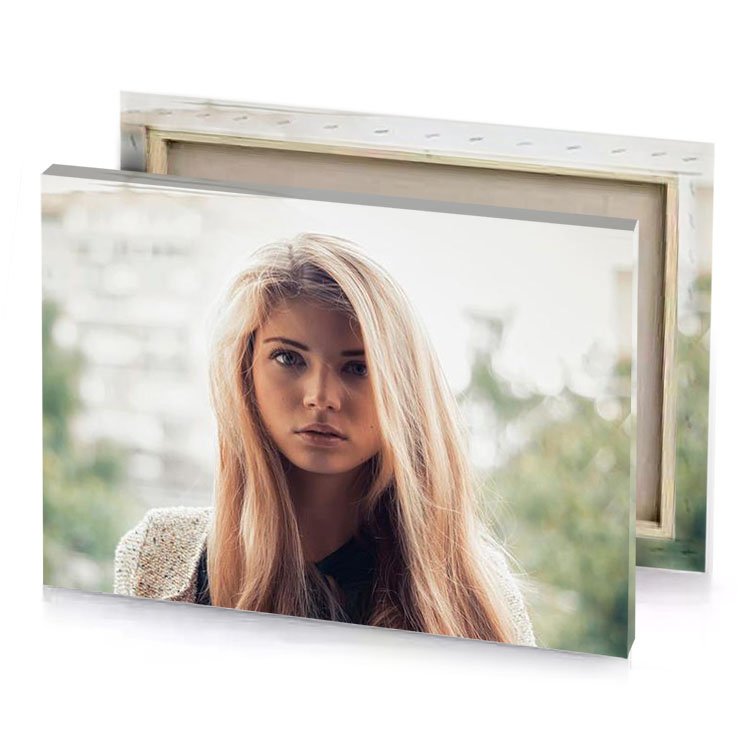 a woman with long blonde hair and black top platinum canvas