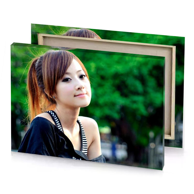 a woman with long hair and black shirt dark green canvas