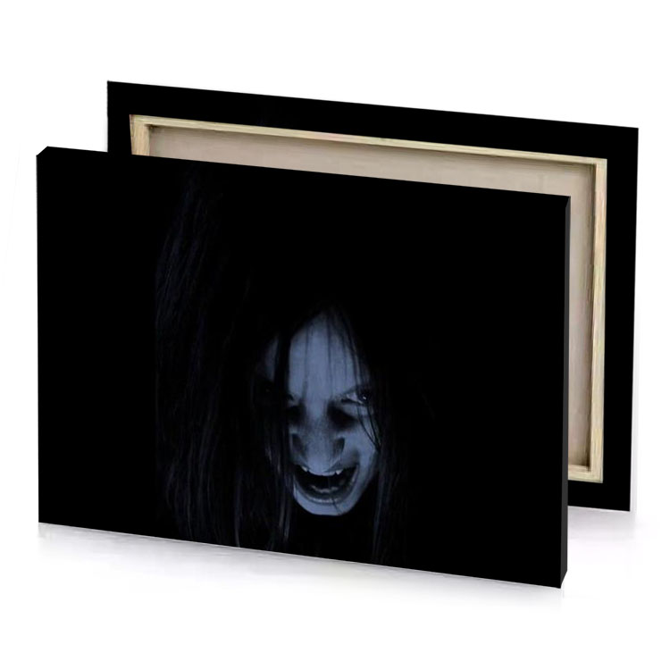 a woman with long hair and black shirt is looking dim gray canvas