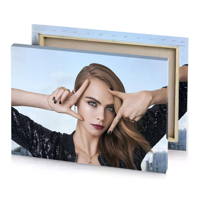 a woman with long hair and black top periwinkle canvas
