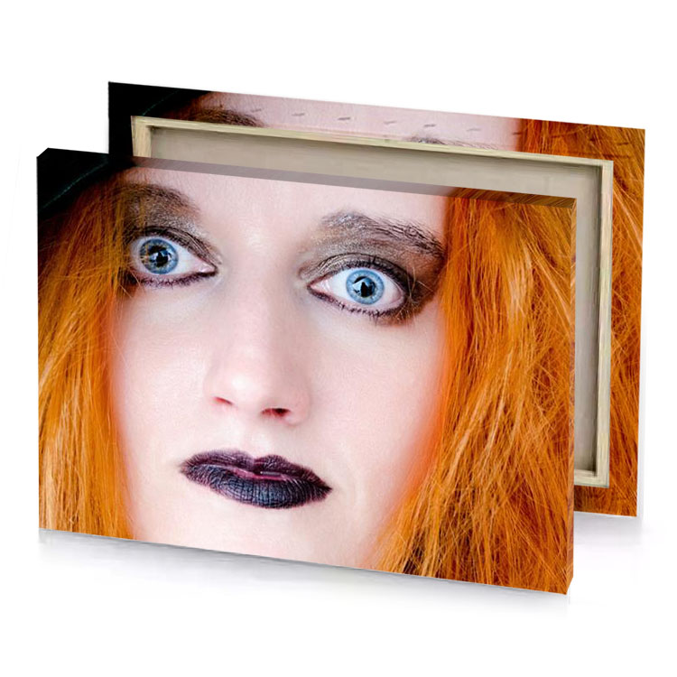 a woman with red hair and black hat mahogany canvas