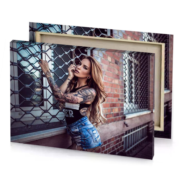 a woman with tattoos leaning against brick wall zinnwaldite brown canvas