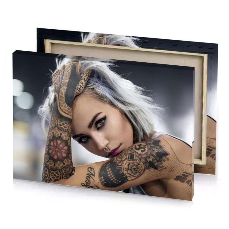 a woman with tattoos on her arms taupe canvas