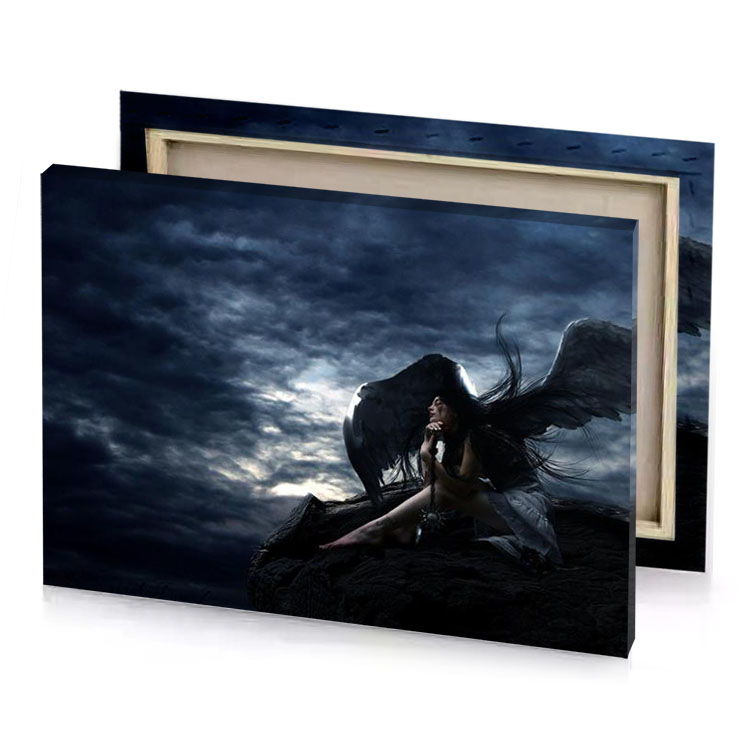 a woman with wings sitting on rock charcoal canvas