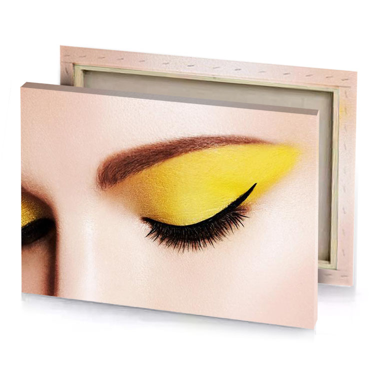a woman with yellow makeup and eyelashes orange canvas