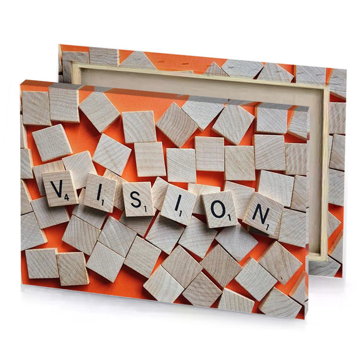 a wooden block with the word vision spelled on it silver canvas