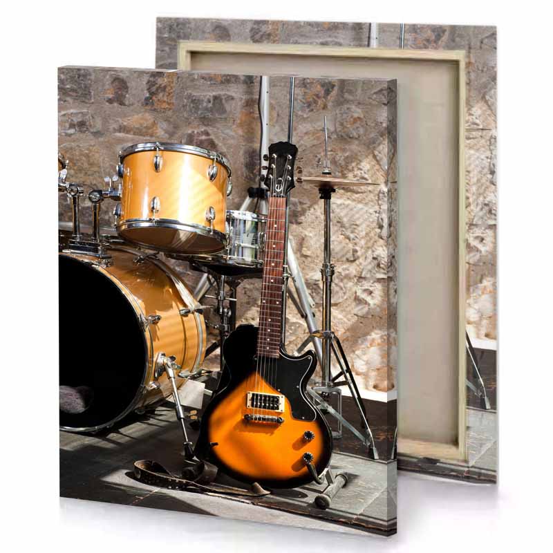 a yellow guitar and black bass sand brown canvas