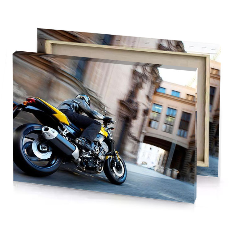a yellow motorcycle is driving down the street smoky black canvas