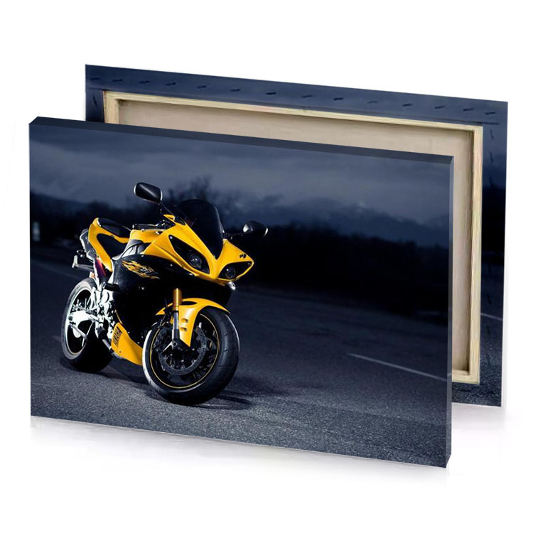 a yellow motorcycle parked on the side of road orange canvas