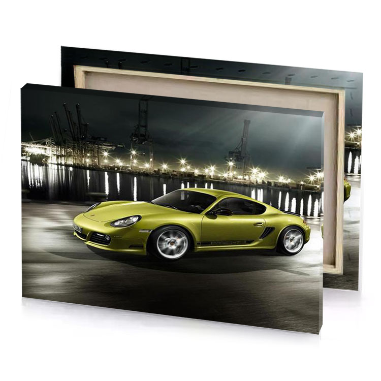 a yellow porsche sports car driving on road dark khaki canvas