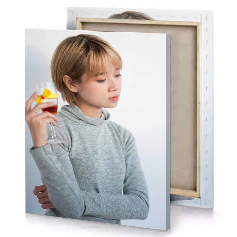 a young boy holding glass of wine manatee canvas