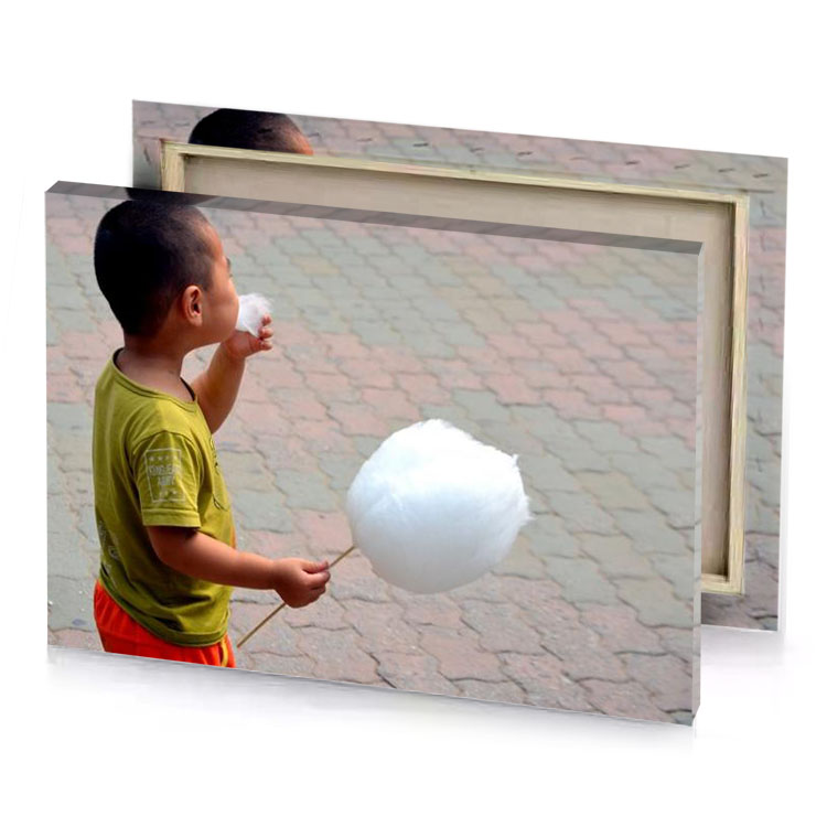 a young boy holding white cotton ball smoke canvas