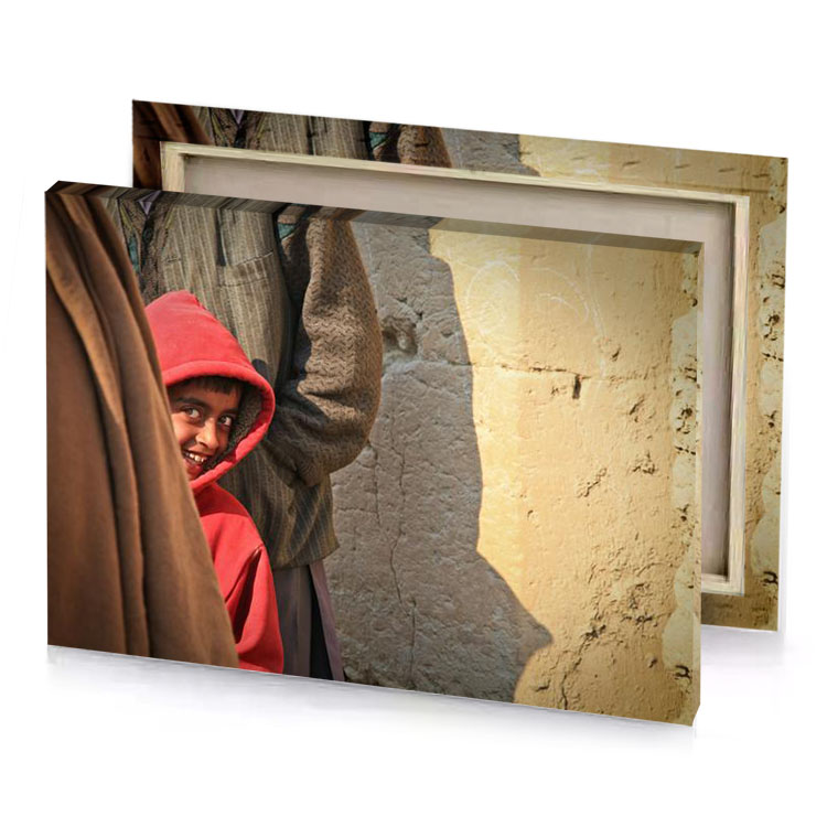a young boy in red hoodie camouflage green canvas