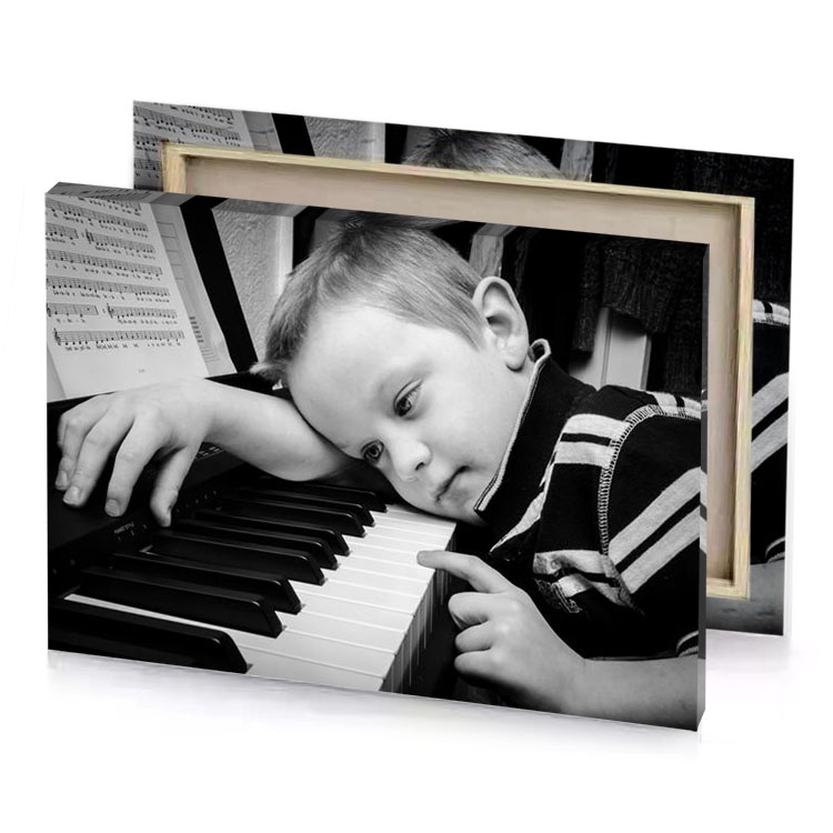 a young boy is playing the piano smoky black canvas