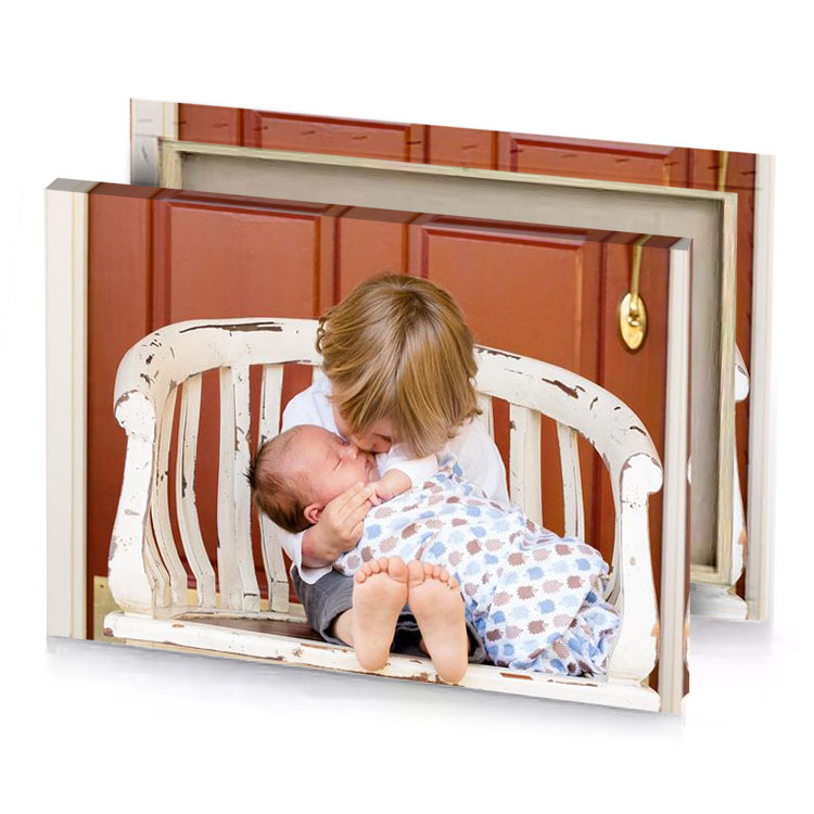 a young boy kisses his mother s cheek on the platinum canvas