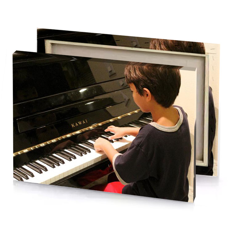 a young boy playing piano in room taupe canvas