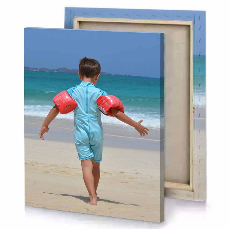 a young boy running on the beach sky blue canvas