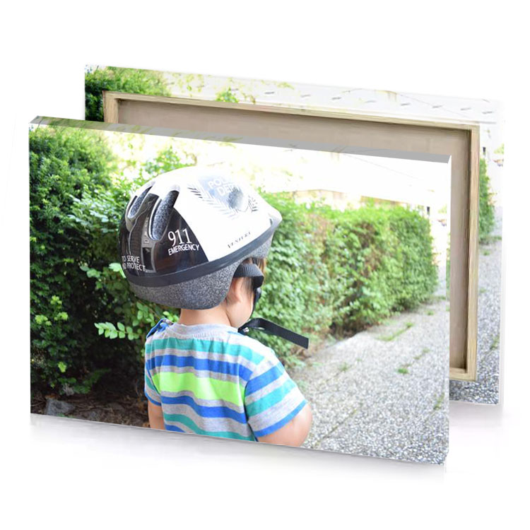 a young boy wearing helmet and holding an umbrella celadon canvas
