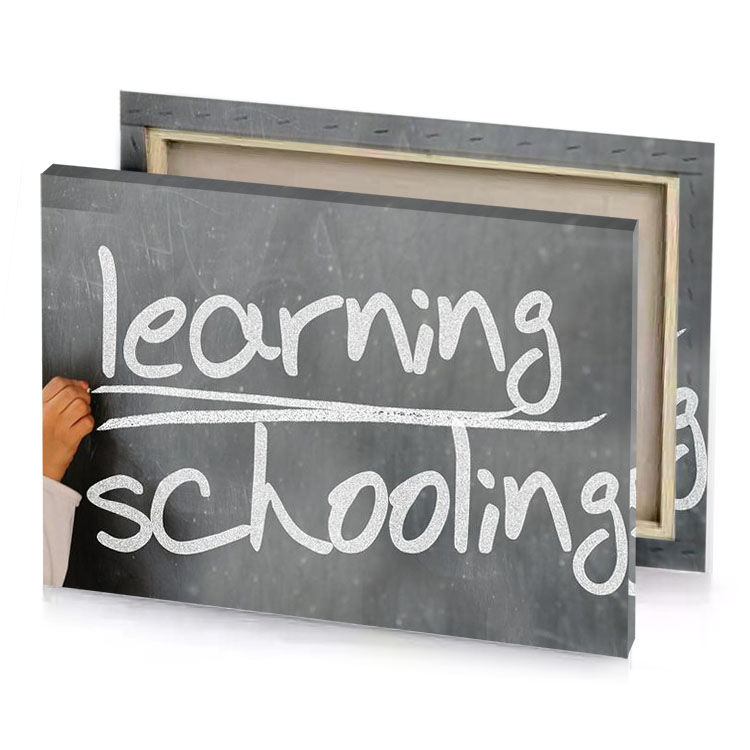 a young boy writing on chalk board gray canvas