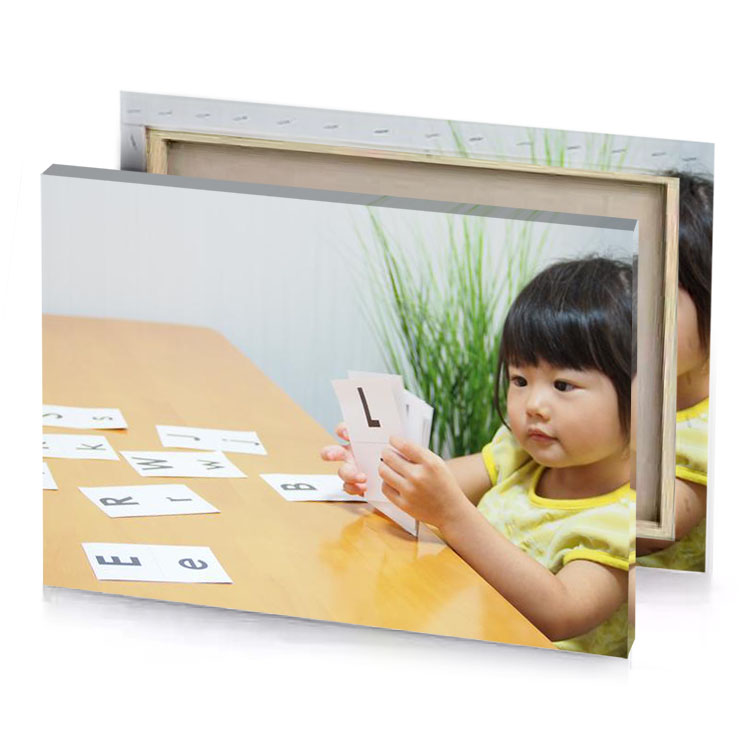 a young girl sitting at table platinum canvas