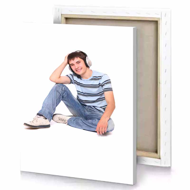 a young man sitting on the floor with his headphones white canvas