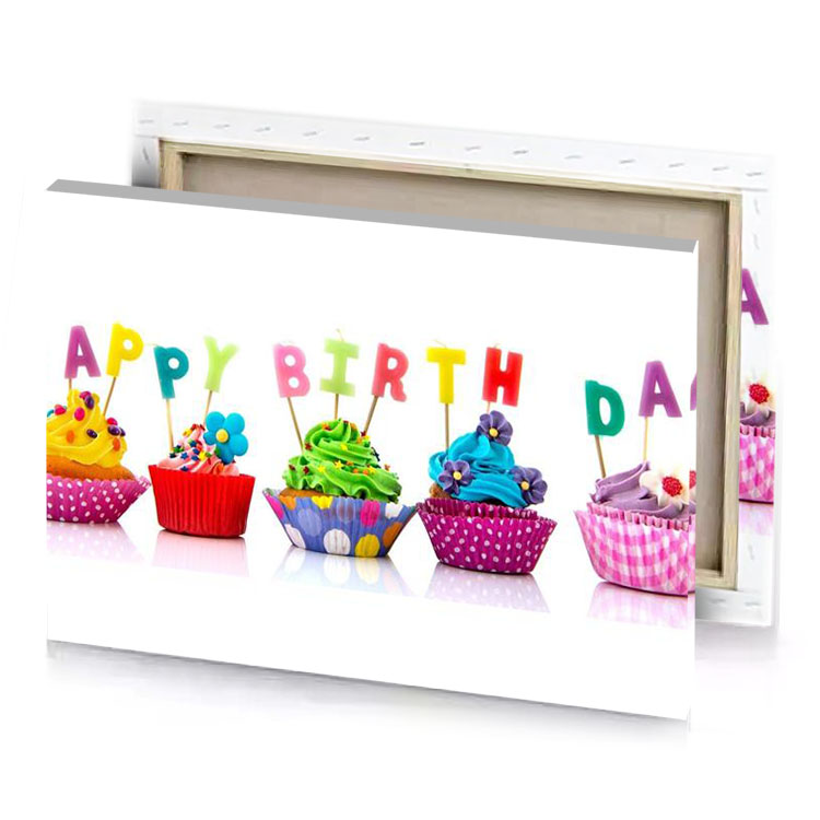 cupcakes with happy birthday candles on white background yellow green canvas