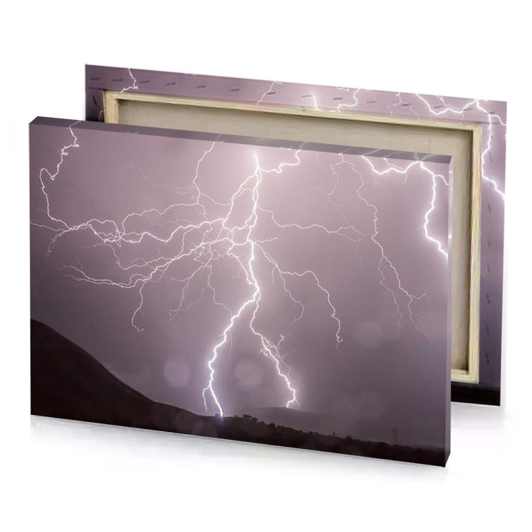 lightning strikes over the mountains in night rose quartz canvas
