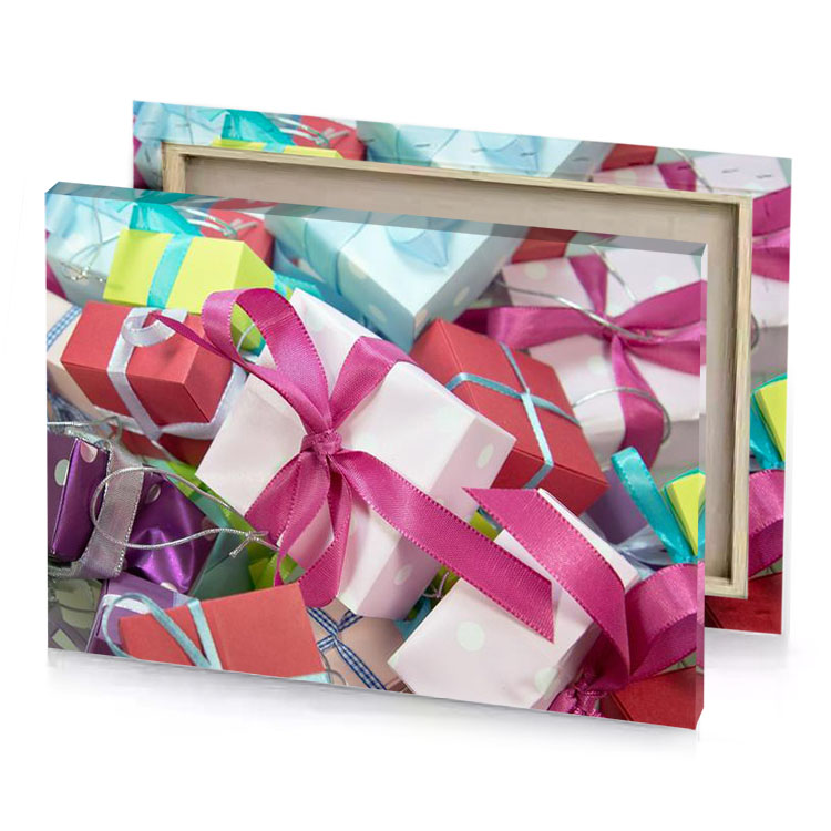 many colorful boxes with ribbons tied around them deep cerise canvas