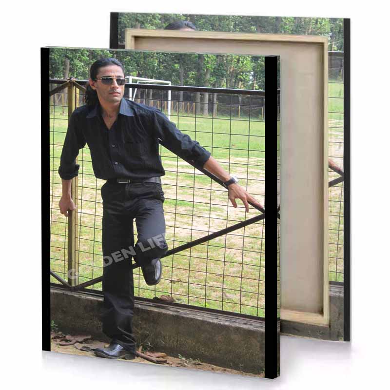 shah in black shirt and jeans tan canvas