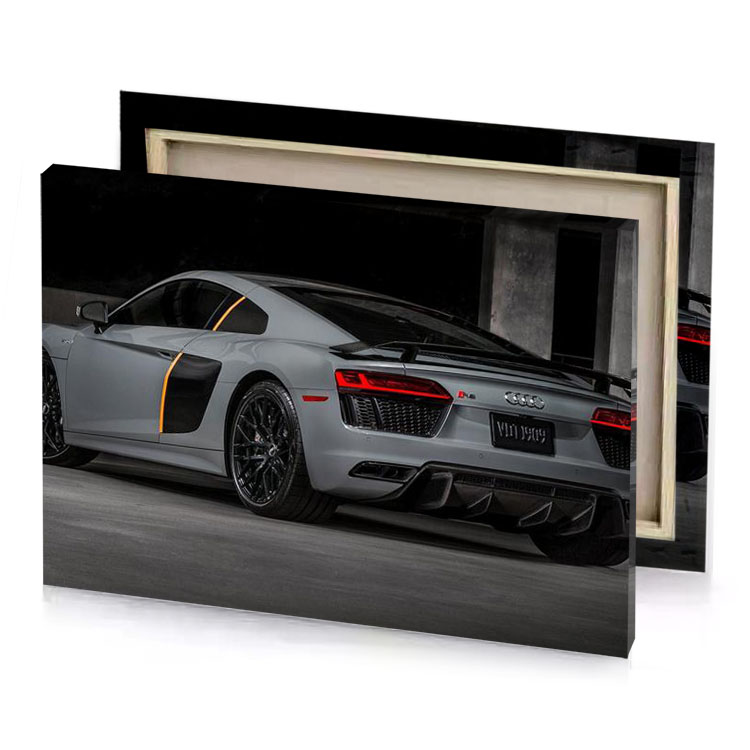 the audi sports car is shown in a dark room gray canvas