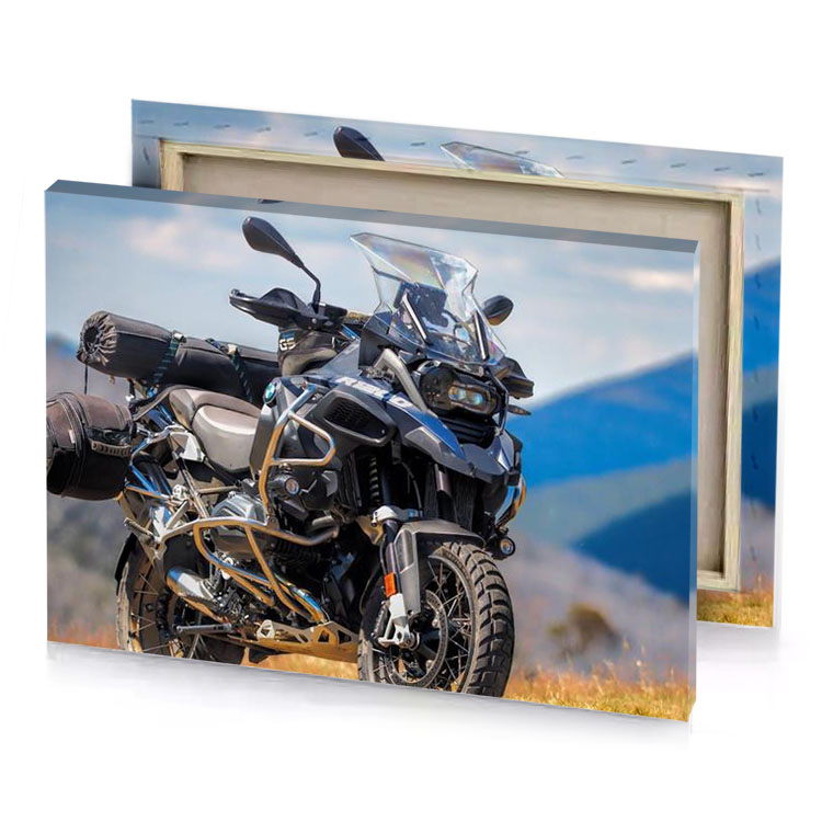 the bmw f800r is parked on a grassy hill smoky black canvas