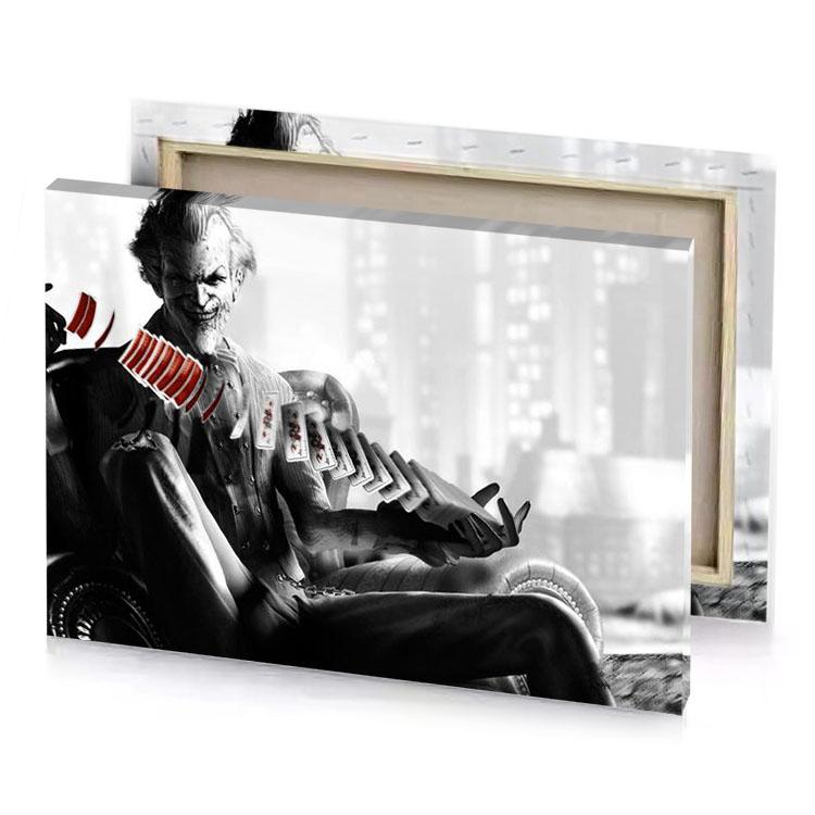 the joker is sitting on a chair in city smoky black canvas