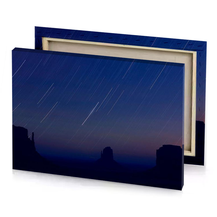 the stars are streaking across sky above monument national park sapphire canvas