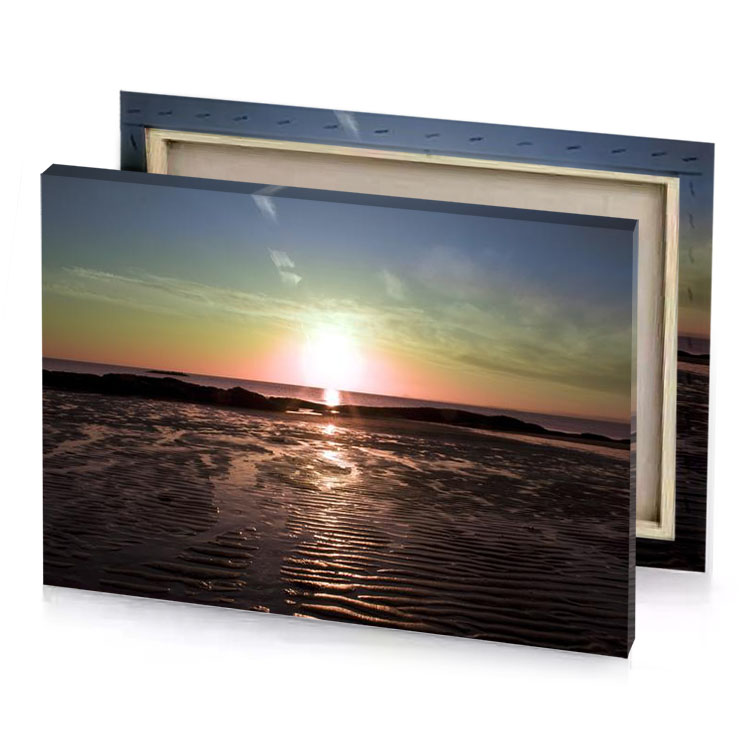 the sun is setting over ocean and sand garnet canvas
