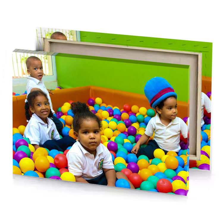 three children sitting in a ball pit golden poppy canvas