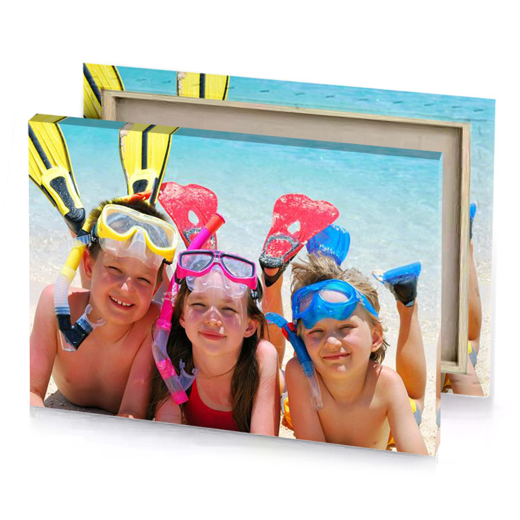 three children wearing flippers and snors on the beach sky blue canvas