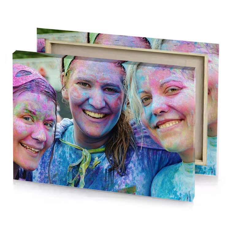 three girls covered in colorful powder lapis lazuli canvas