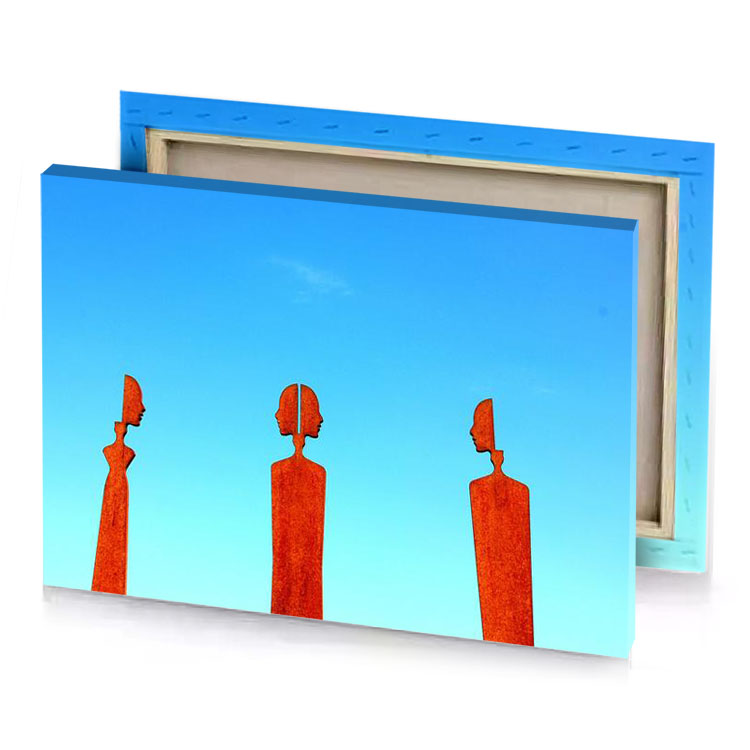three statues of people blue jeans canvas